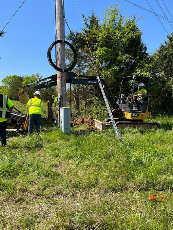 Crews from National OnDemand are helping bridge the digital divide by delivering fiber optic service to people all over the country. This crew is preparing to install fiber using an excavator