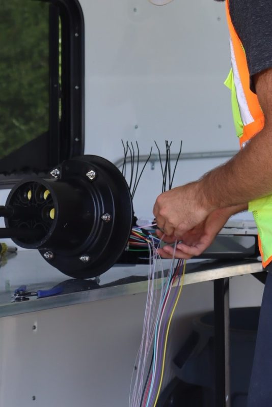 Fiber Optic Splicing: One of our technicians carefully prepares fiber for splicing. 